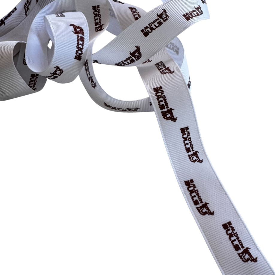 White ribbon with brown text and logo on a white background